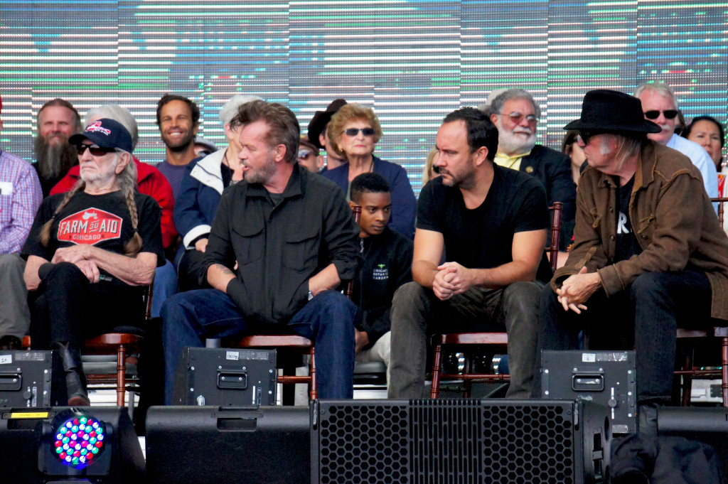Darius Jones, the coordinator of the rooftop farm at Chicago's McCormick Place convention center, had a place of honor on the stage during the star-studded news conference that preceded the Farm Aid concert in the city Sept. 19. That's him in the front row of an invited group of farm advocates, between artists John Mellencamp and Dave Matthews, who are flanked by fellow Farm Aid members Willie Nelson (left) and Neil Young (right). Photo by Bob Benenson/FamilyFarmed