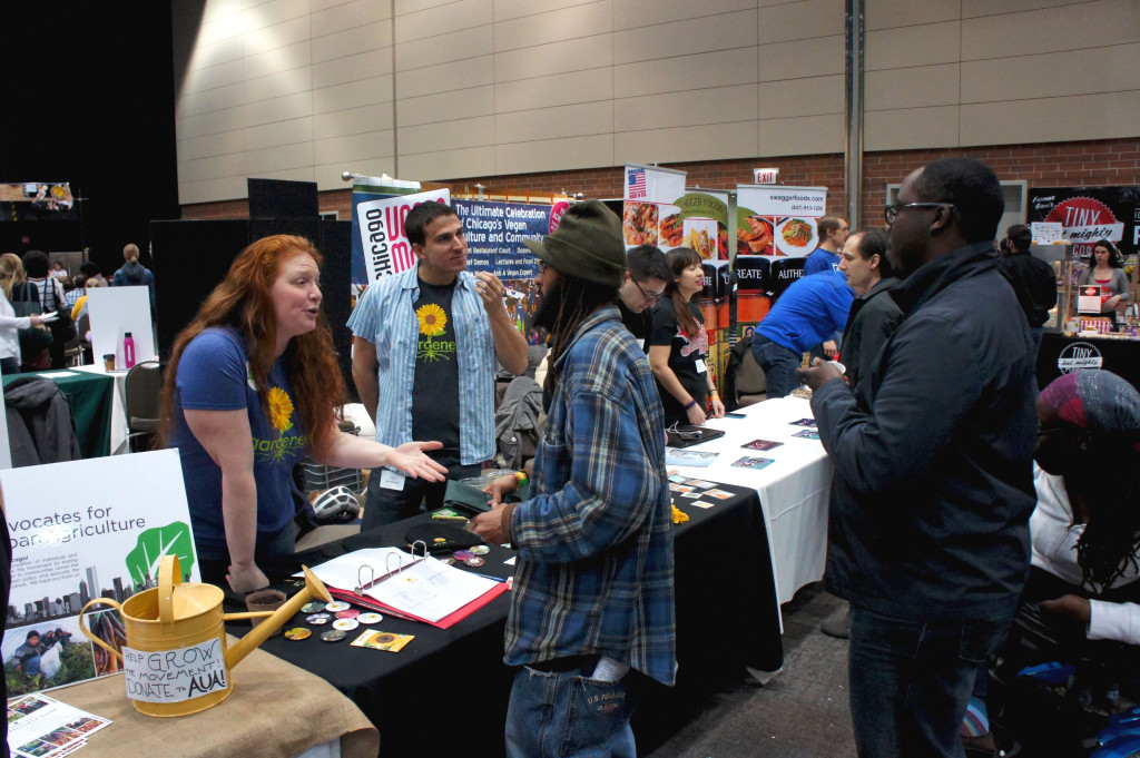 Representatives of Gardeneers, an organization that teaches Chicago schoolchildren how to grow produce, discuss their program with Good Food Festival attendees.